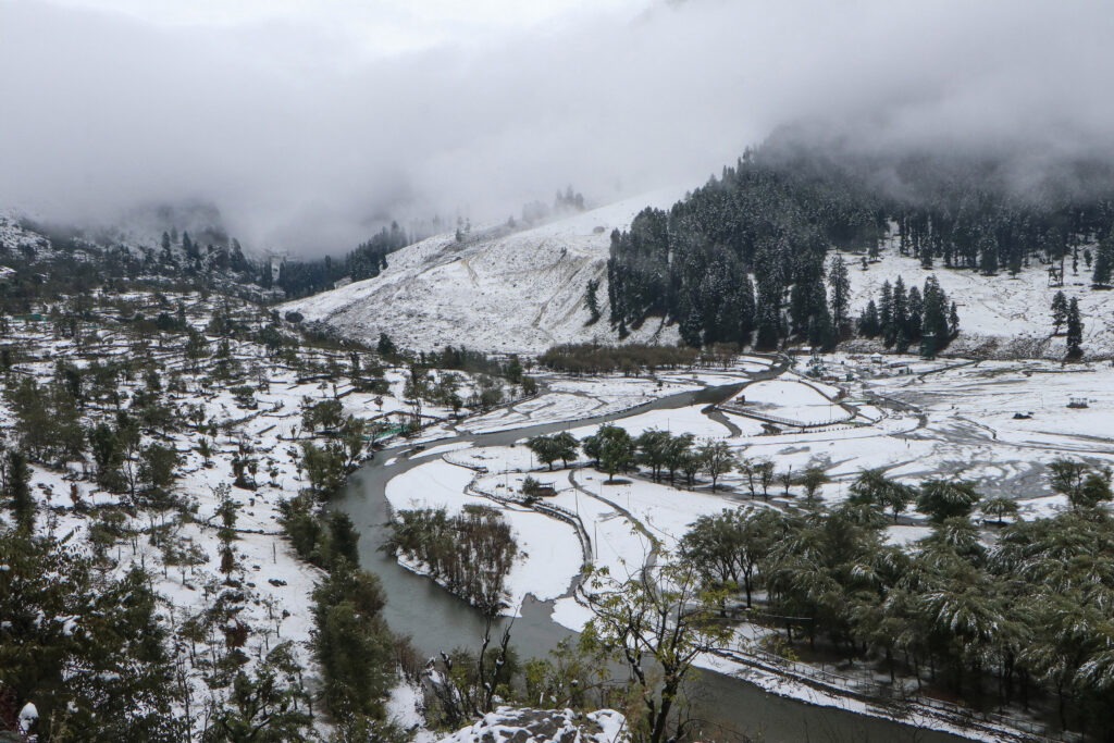 Kashmir Turns White as Hills Receive Snowfall, Plains Lashed by Rain and Gusty Winds